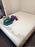 Full view of mattress with bedding on top