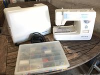 Whole lot showing machine, cover, foot pedal and accessory box