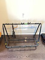 Full view of 5-guitar rack with single stand inside frame