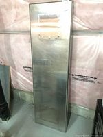 Full front view of stainless steel worktop section showing overall form and top access panel