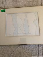 Full view of framed artwork showing image, mat and frame