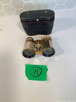 Opera glasses with closed case