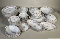 All pieces grouped showing variety of plates and serving dishes