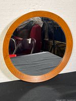 Front view showing teak frame and glass