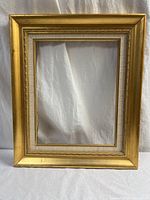 Front view of entire gold gilt wood frame