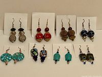 All eight earring pairs displayed