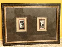 Full view of framed piece showing two matted cigarette cards