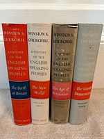 Spines of all four volumes showing titles, author, publisher