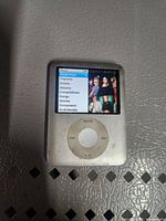 Front view showing screen displaying menu and click wheel controls