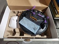 Robot vacuum and charging dock in original packing