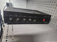 Front view of Bogen Classic Series C100 amplifier showing control knobs and power switch