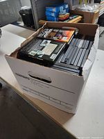 Full banker-style box filled with DVD cases