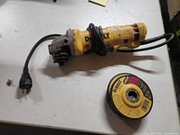 Grinder with power cord and one DeWalt disc