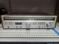Front view of Kenwood KR-720 receiver showing full faceplate and wooden case