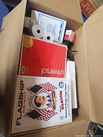 Top view showing copy paper, notebook, thermal rolls