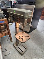 Full view of drill press showing base, column, table and head