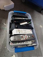 Top view of tote showing multiple remote controls stacked