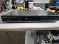 Front view displaying Technics ST-K55 tuner powered on at 98.1 MHz