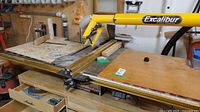 Full view of table saw with overarm guard and extensions