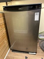 Front view showing stainless door, Danby Designer badge, size reference