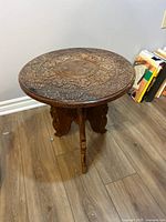 Full view of round carved folding table