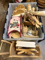 Bin containing assorted unfinished wood blanks and folk art pieces