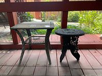 Square wicker table and round metal table side by side