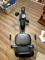 Top view of bike showing seat, handles, console, pedals