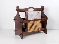 Front view of wood magazine rack with magazines inside illustrating size