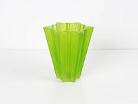 Full view of green star-shaped glass vase