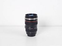 Front view of camera lens style tumbler mug