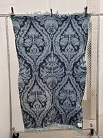 Full view of patterned lambswool throw hanging