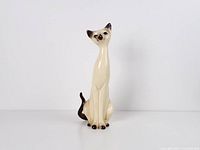 Full view of ceramic Siamese cat figurine