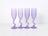 Front view of four frosted purple zigzag stem champagne flutes