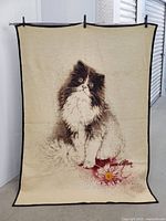 Full view of blanket showing cat and flower design