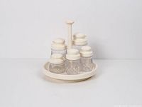 Front view of entire condiment set