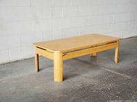 Top and side view of coffee table showing overall style and condition