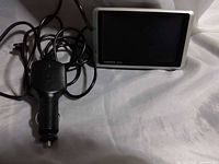 GPS unit with charger shown together