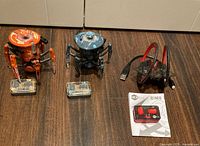 Full lot with both Battle Spiders, Ring Racer, their remotes, cable and manual