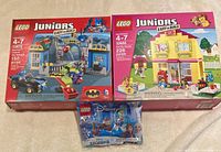 Front view of LEGO Juniors 10672 and 10686 boxes with sealed Frozen II polybag
