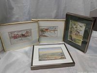 Group shot of four framed prints showing frames and subjects