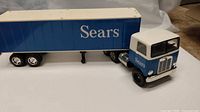 Full view of blue Sears tractor-trailer toy