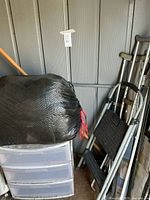Entire lot showing plastic drawer unit, black bag, crutches, step stool, broom handle