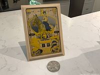 Calendar in frame with coin in foreground