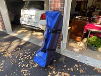 Full view of Bag Boy golf travel bag standing upright