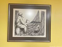 Full view of framed lithograph on wall