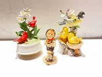 Front view of three figurines in lot