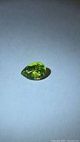 Pear-cut green peridot front view