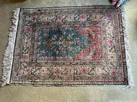 Full view of rectangular rug showing overall design and fringe