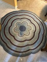 Overhead view of larger round braided rug showing full design